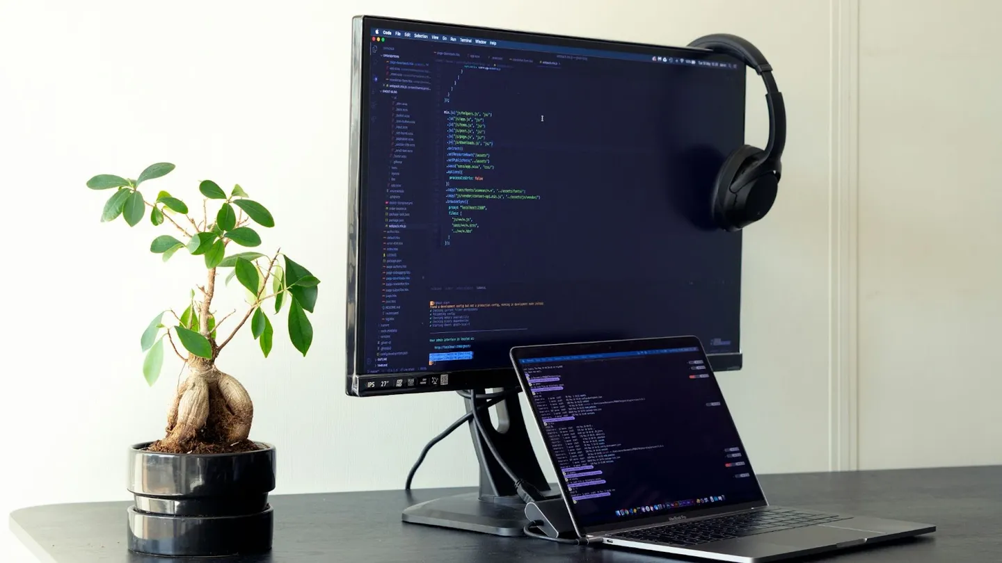 Why Developers Need Test Automation Practice Applications a computer sitting on a desk, with a testing app visible on the screen.